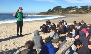 Junior Researchers with program leader Mara at the beach