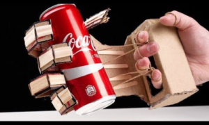 Robot hand holding a can of soda